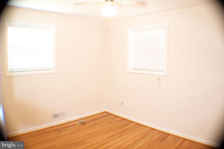 3710 Kayson Street Silver Spring, MD 20906 - Photo 13 of 24 a view of a small space with wooden floor and a window
