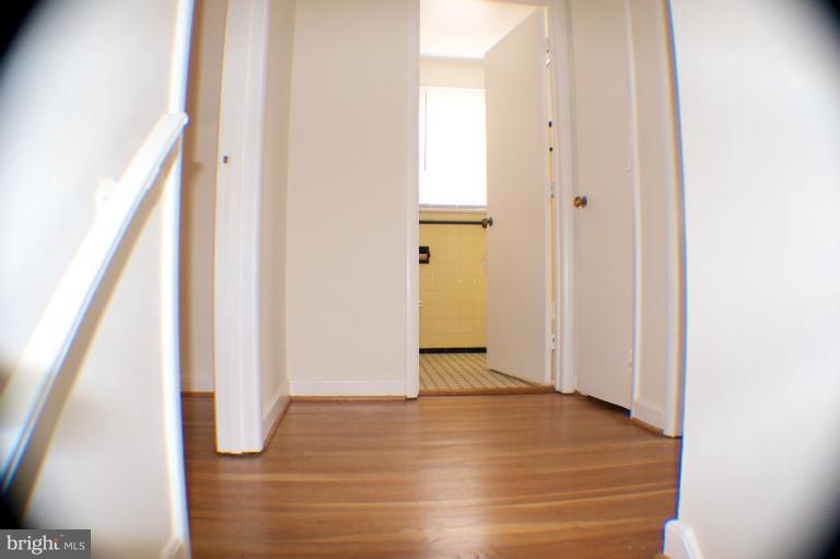 3710 Kayson Street Silver Spring, MD 20906 - Photo 23 of 24 an empty room with wooden floor and entrance