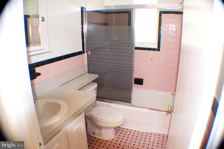 3710 Kayson Street Silver Spring, MD 20906 - Photo 5 of 24 a bathroom with a toilet and a shower