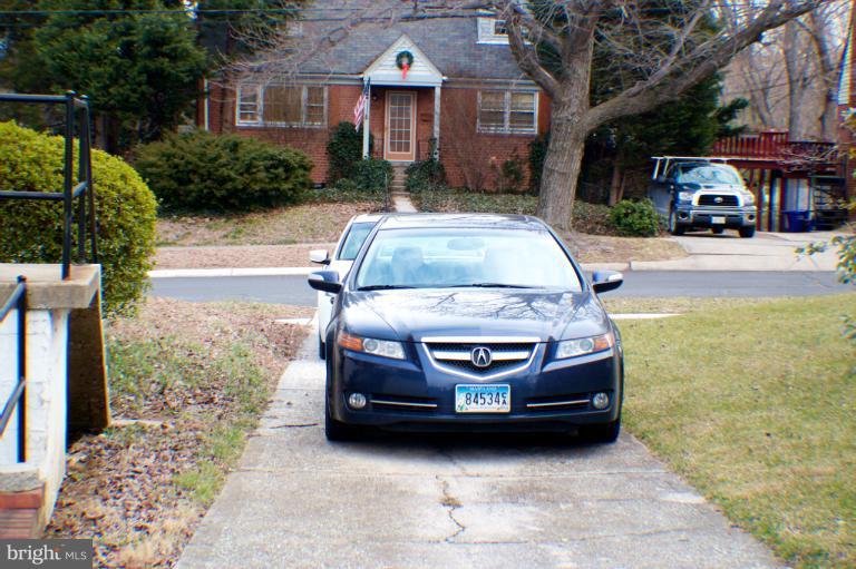 3710 Kayson Street Silver Spring, MD 20906 - Photo 6 of 24 a car parked in front of a brick house