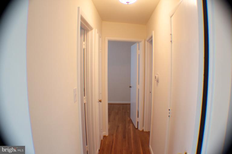3710 Kayson Street Silver Spring, MD 20906 - Photo 9 of 24 a view of a bathroom from a corridor