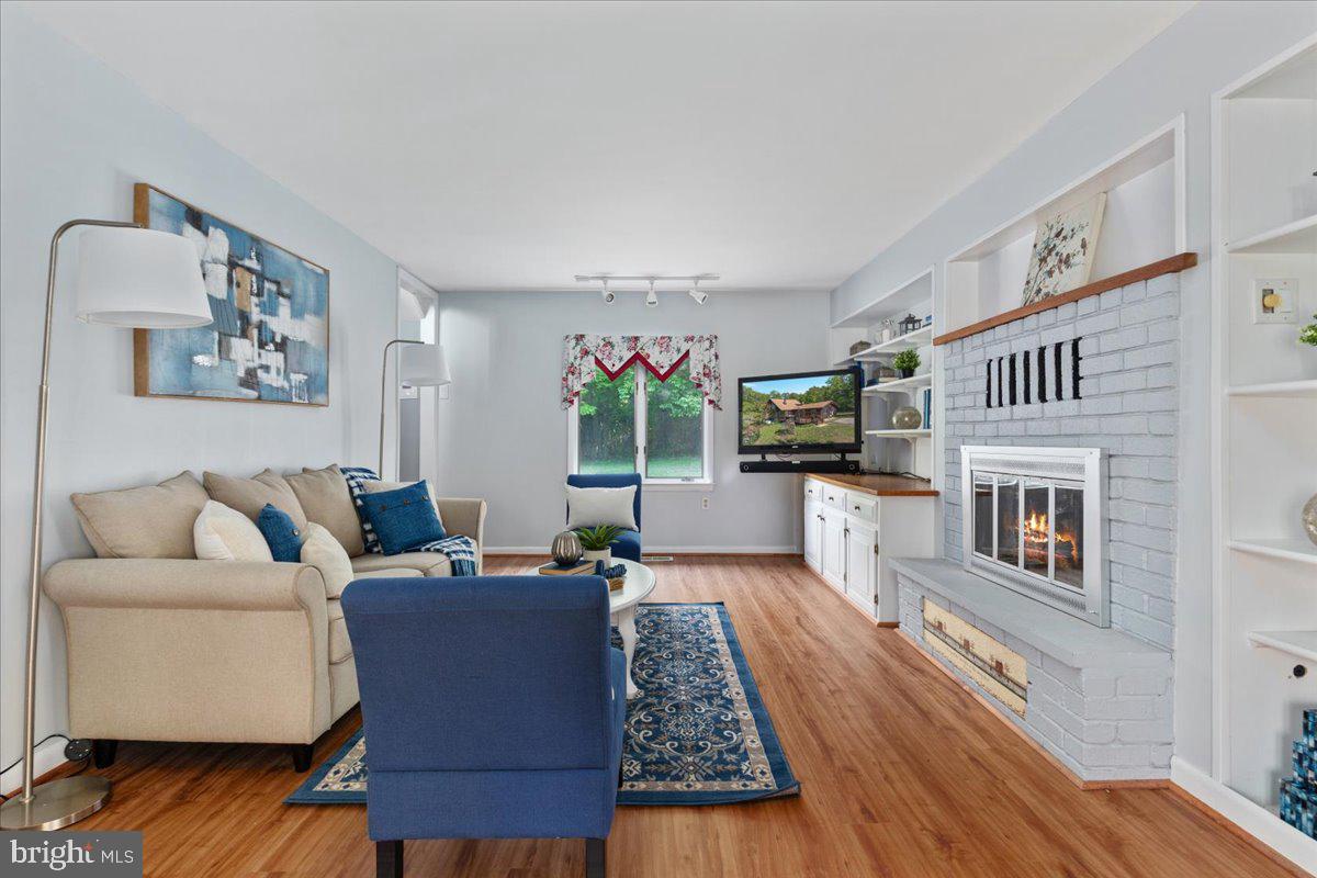 146 Lizzie Mills Road Castleton, VA 22716 - Photo 15 of 91 a living room with furniture and a fireplace