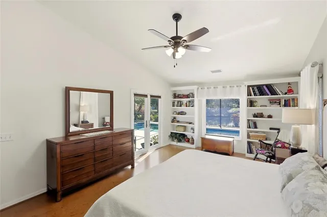 a bedroom with a bed dresser and a window