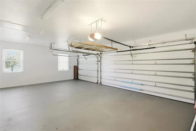 a dining room with furniture and white walls