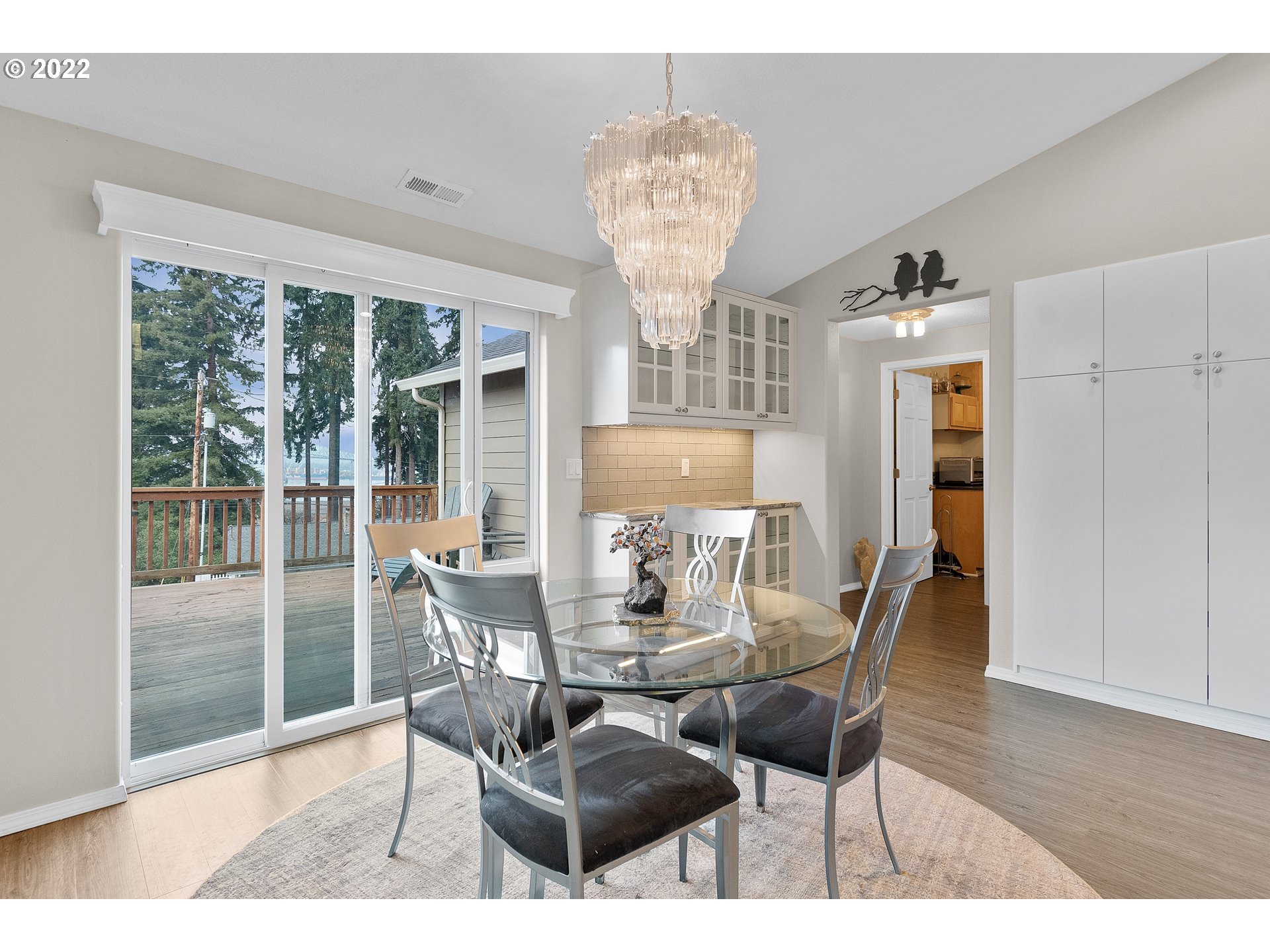 29682 View Street Rainier, OR 97048 - Photo 16 of 30 a dining room with furniture a chandelier and wooden floor