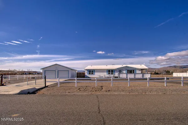 a view of a house with a big yard