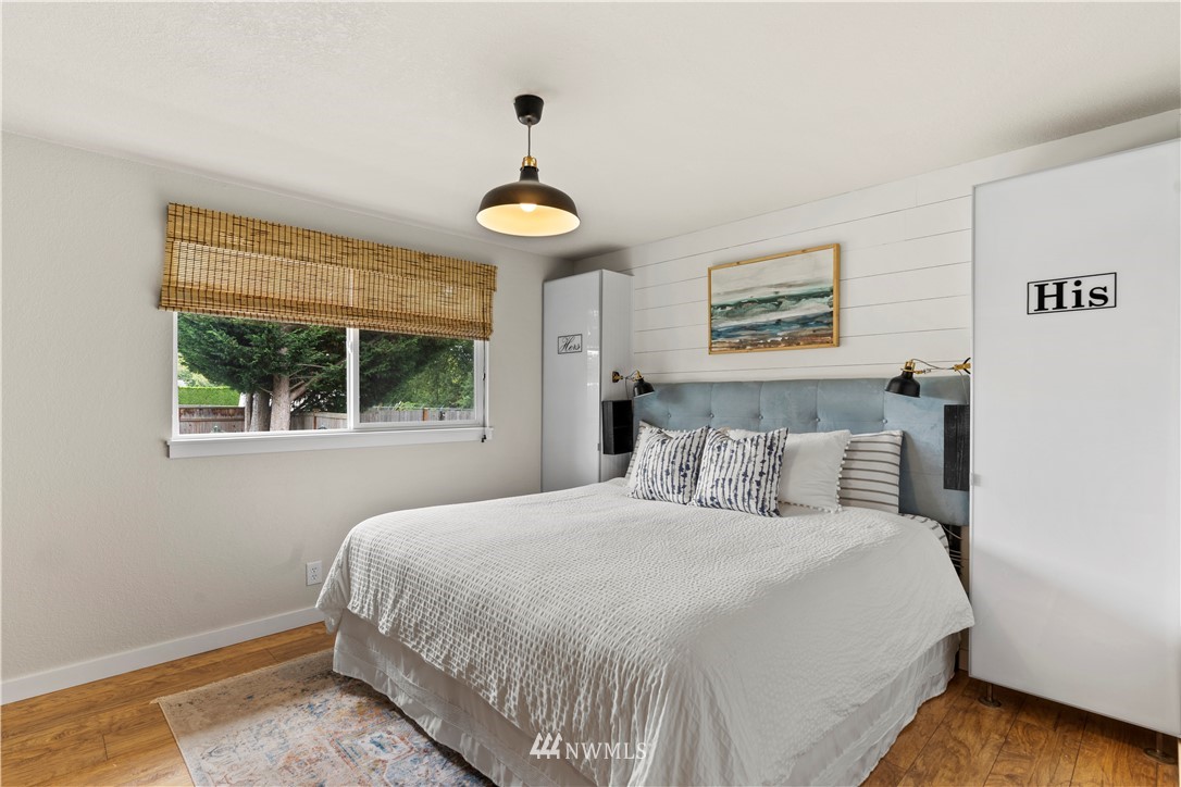 1128 235th Place Southwest Bothell, WA 98021 - Photo 13 of 22 a bedroom with a bed and a window
