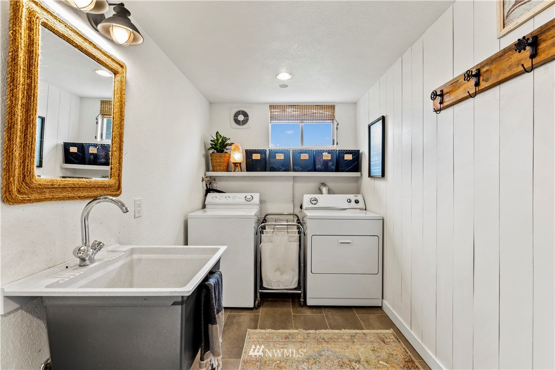 1128 235th Place Southwest Bothell, WA 98021 - Photo 16 of 22 a bathroom with a sink toilet and a mirror