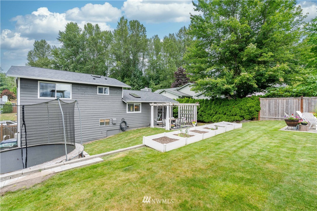 1128 235th Place Southwest Bothell, WA 98021 - Photo 22 of 22 a front view of a house with a yard
