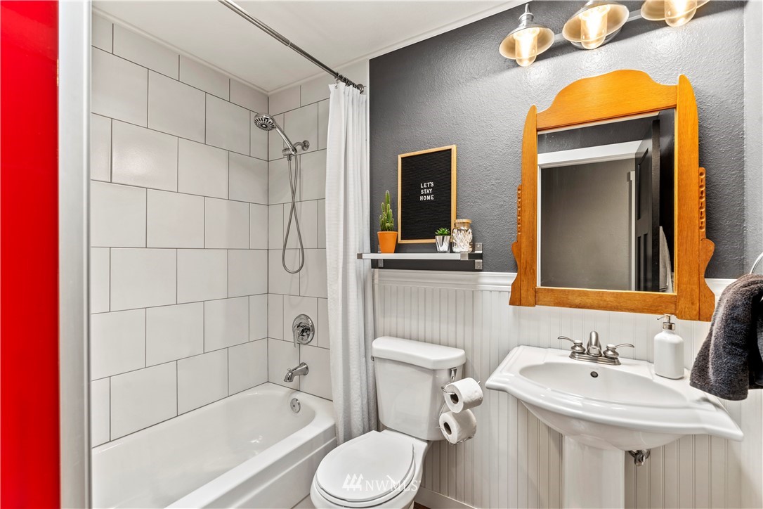 1128 235th Place Southwest Bothell, WA 98021 - Photo 10 of 22 a bathroom with a sink toilet and shower