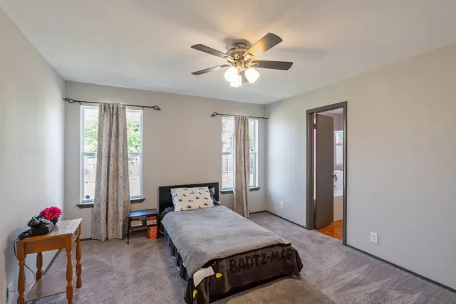 a bedroom with a bed and window