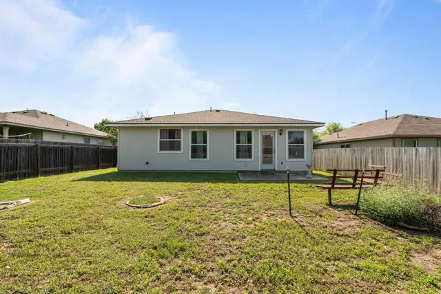 a swimming pool with lots of trees in the background