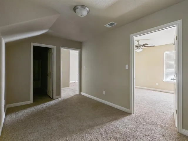 an empty room that has a mirror