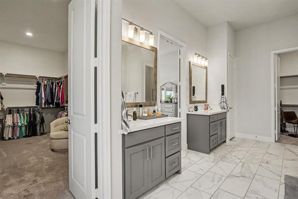 573 Broadleaf Way Haslet, TX 76052 - Photo 25 of 35 a view of bathroom with a sink and a mirror
