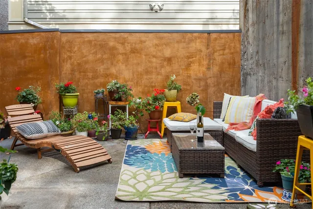 a outdoor living space with furniture and a potted plant