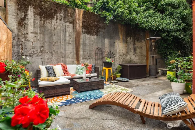 a outdoor living space with furniture and flowers