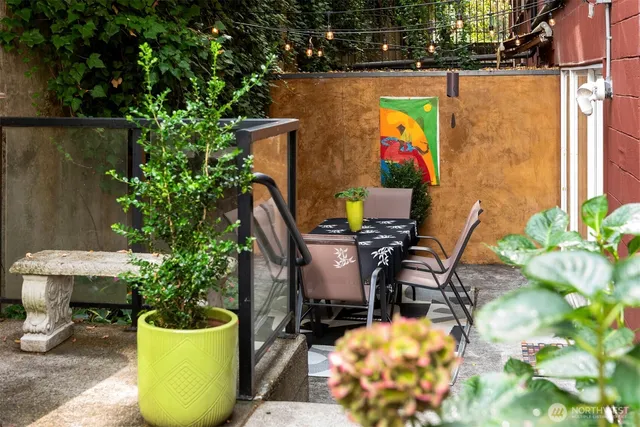 a view of an chairs and table in the patio