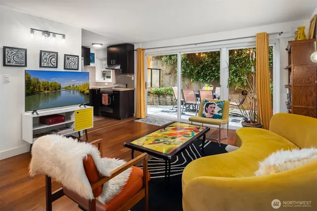 a living room with fireplace furniture and a flat screen tv