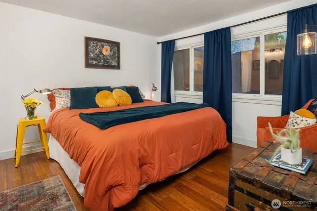 a bedroom with bed and window