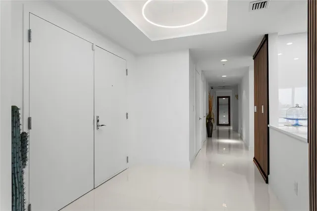 a kitchen with stainless steel appliances a refrigerator and a cabinets