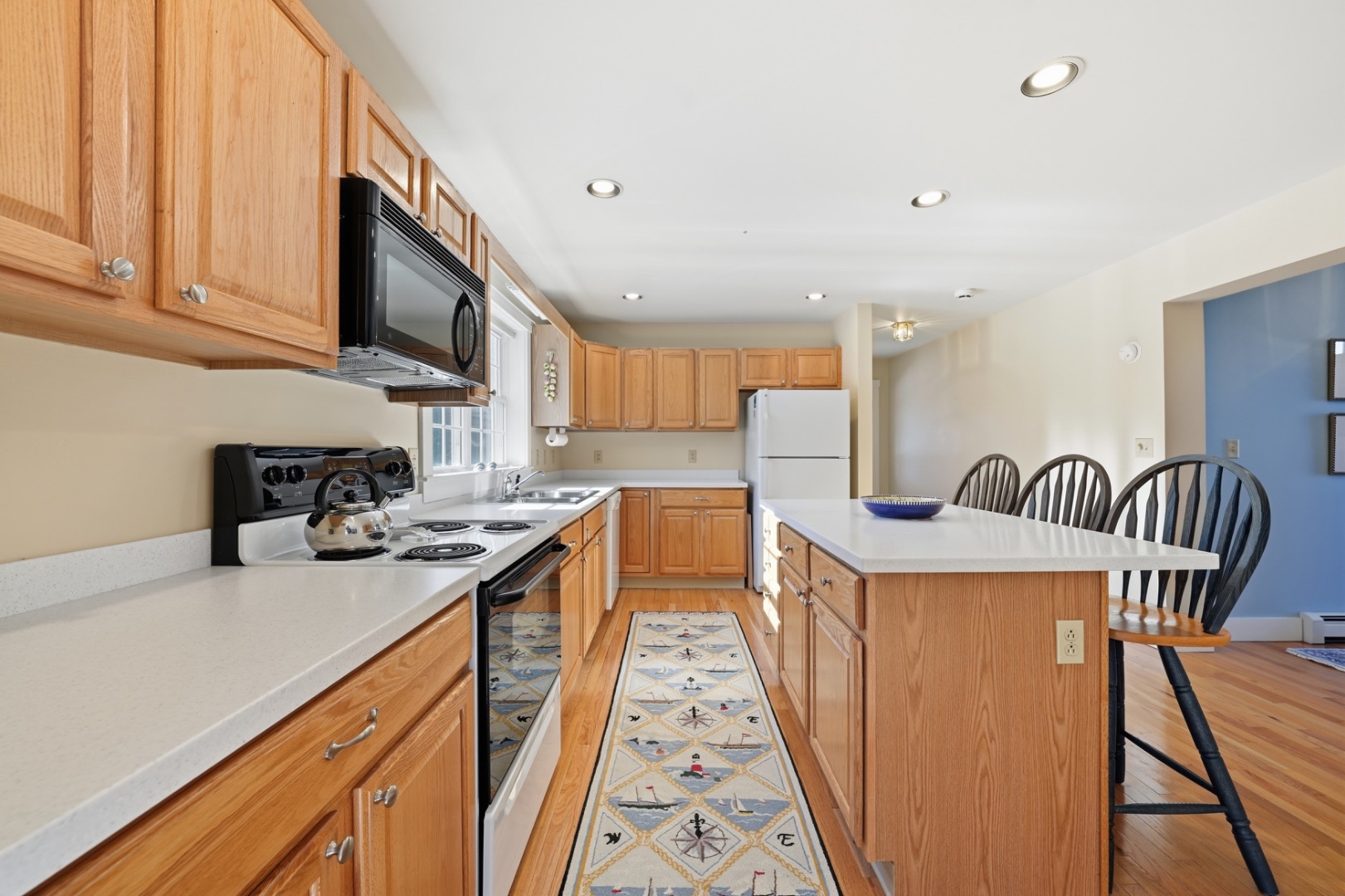 20 Rudder Lane Nantucket, MA 02554 - Photo 15 of 34 a kitchen with granite countertop lots of counter top space and stainless steel appliances
