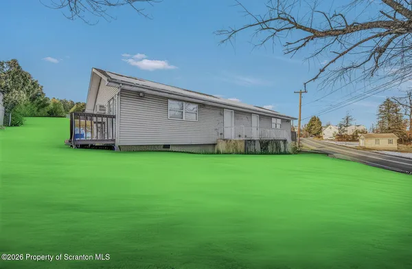 a view of a house with a back yard