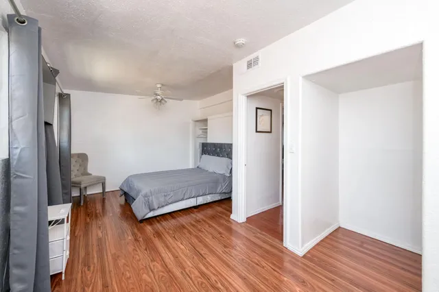 a bedroom with a bed and a table