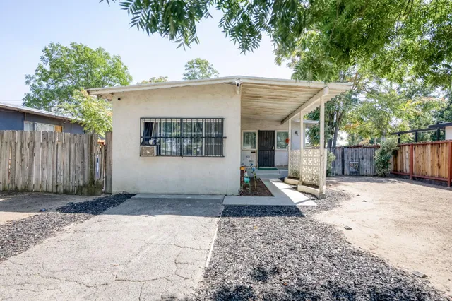 a house with trees in the background