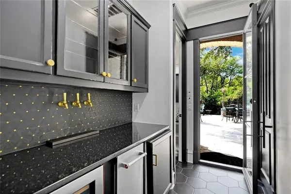 a bathroom with a granite countertop sink mirror vanity and toilet