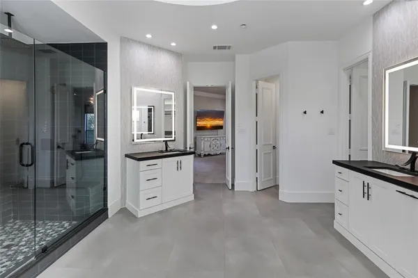a kitchen with cabinets and white stainless steel appliances