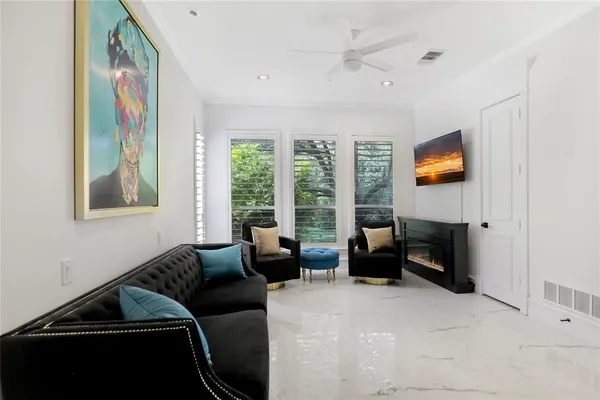a view of hall way with furniture and entryway
