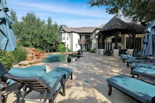 a view of patio with chairs and a table