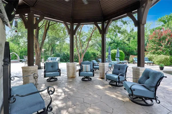 a view of a patio with swimming pool
