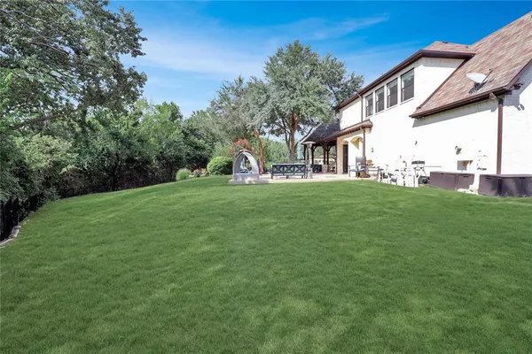 a view of a house with a yard and garage