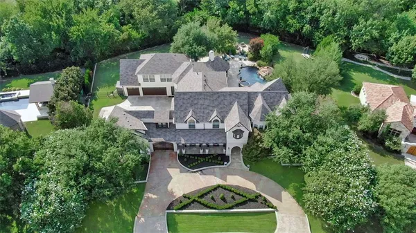 an aerial view of a house with a garden
