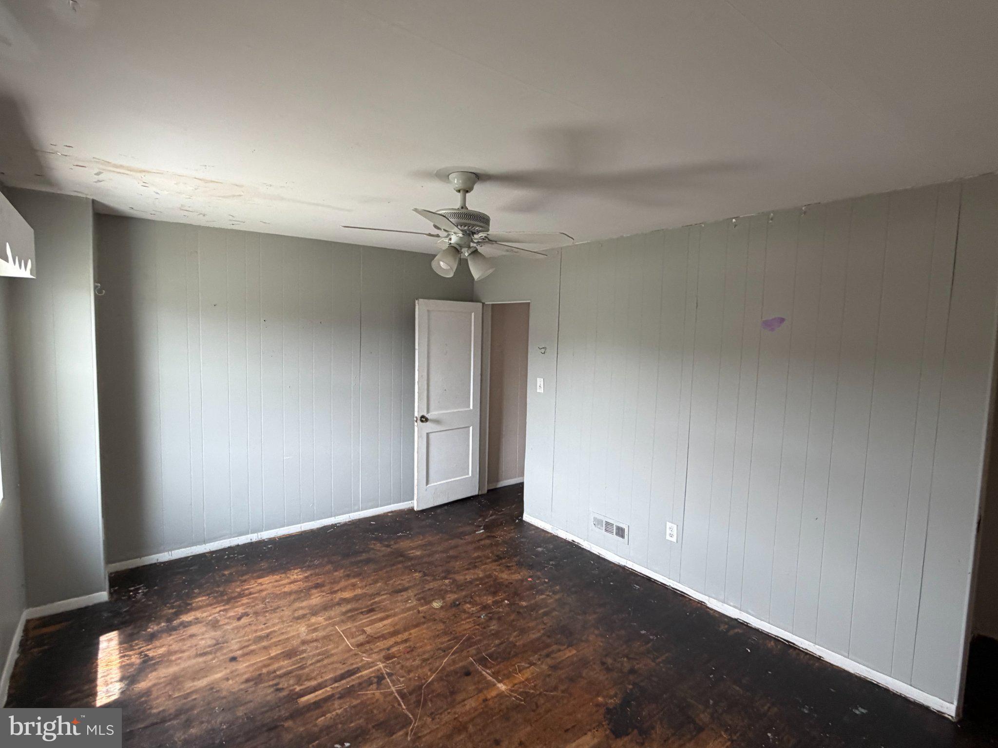 7216 Conley Street Baltimore, MD 21224 - Photo 7 of 14 Spacious room with potential charm.