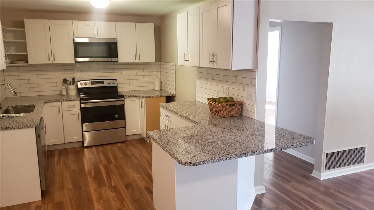 With space saving amenities, all you need is a counter depth refrigerator to complete this ergonomically designed cottage kitchen.