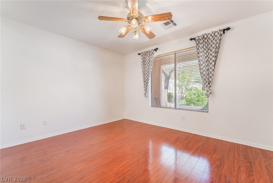5389 Progresso Street Las Vegas, NV 89135 - Photo 20 of 41 Hardwood flooring reflects natural light in this comfortably sized room.