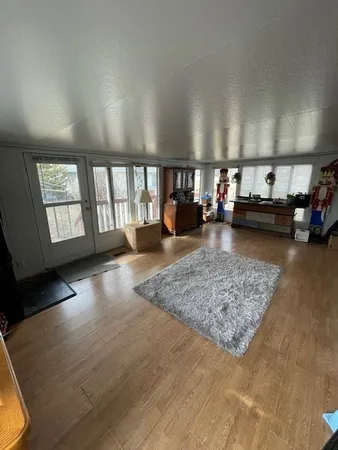 a room with furniture and a wooden floor