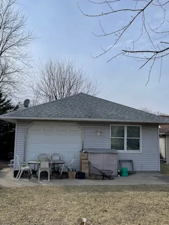 a front view of a house with garage