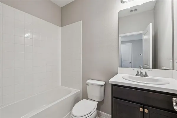 a bathroom with a granite countertop sink mirror and double