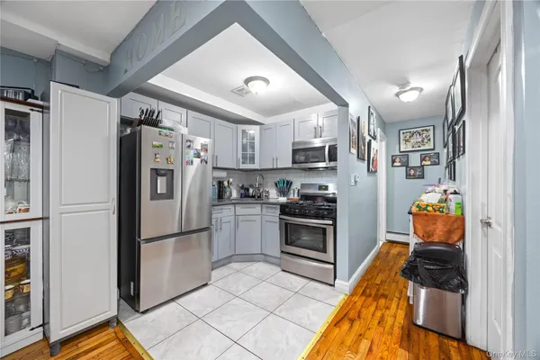 a kitchen with stainless steel appliances granite countertop a refrigerator stove and sink