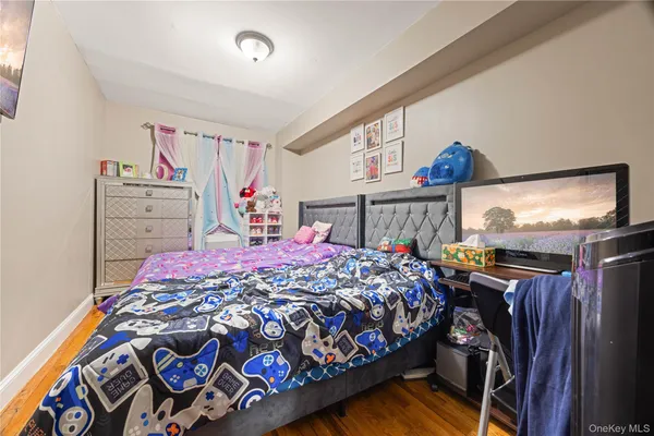 a bedroom with a bed and dresser