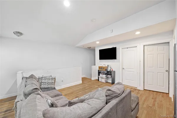 a bedroom with a bed and flat screen tv