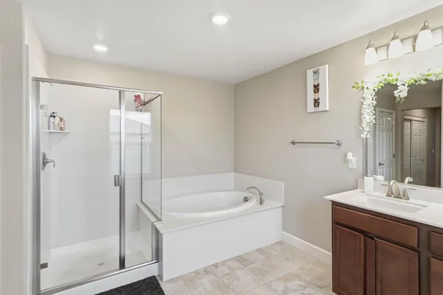 a bathroom with a bathtub and a sink