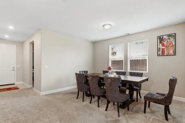 a view of a dining room with furniture