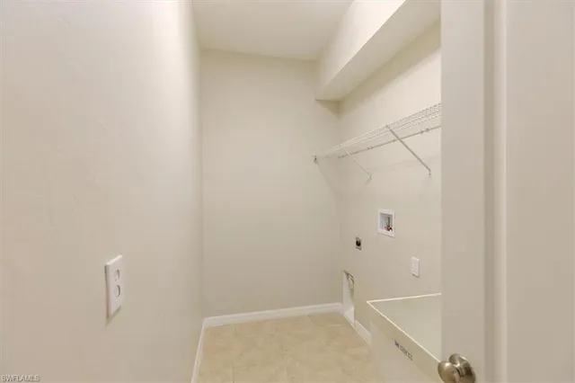 a view of a room with windows and ceiling fan