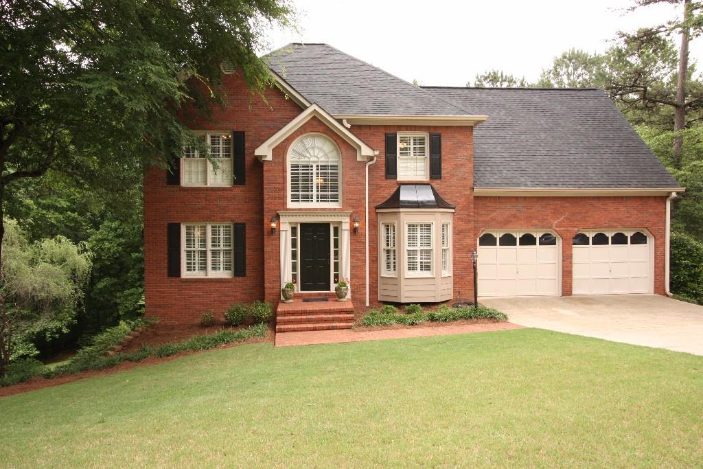 Brick front and cement siding - and notice "Plantation Shutters"!