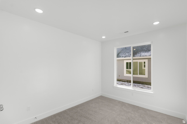 537 South Rivergate Drive Logan, UT 84321 - Photo 8 of 20 White walls, recessed lighting, and a window with white trim