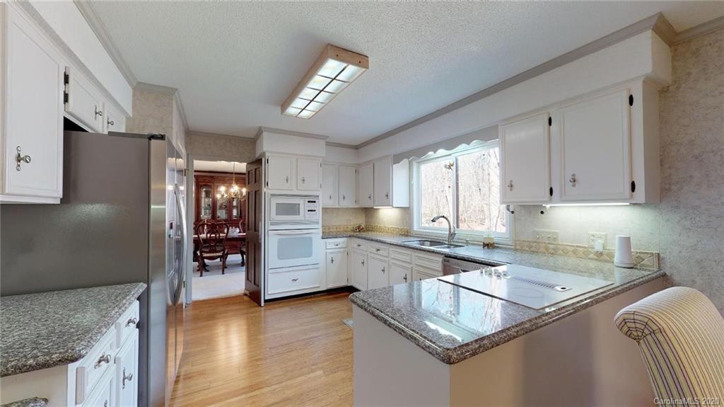 3002 High Ridge Road Charlotte, NC 28270 - Photo 11 of 41 a kitchen that has a sink cabinets counter space and appliances